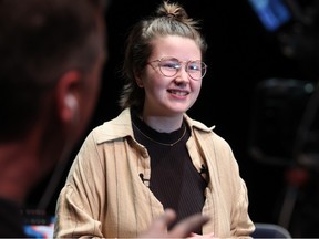 Jeopardy! winner Mattea Roach chats with media after speaking to students at Webber Academy in Calgary on Tuesday.