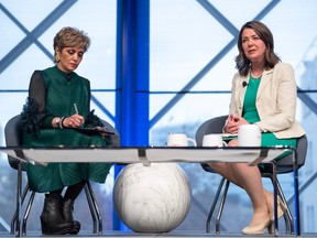 Mayor Jyoti Gondek, left, and Alberta Premier Danielle Smith have a conversation during the Report to Community event at Telus Convention Center in downtown Calgary on Tuesday, April 18.
