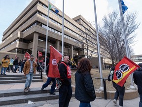 Government workers hold a picket outside the federal government Harry Hays Building in downtown Calgary on Wednesday, April 19, 2023.