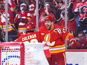 Calgary Flames forward Milan Lucic celebrates with Blake Coleman after scoring against the Anaheim Ducks at the Scotiabank Saddledome in Calgary on Sunday, April 2, 2023.
