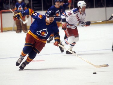 Lanny McDonald of the Calgary Flames skates on the ice during the
