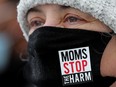 FILE PHOTO: Angela Welz, board member with Moms Stop The Harm, takes part in a protest organized by Albertans For Ethical Drug Policy at the Alberta Legislature in Edmonton, on Wednesday, February 23, 2022.