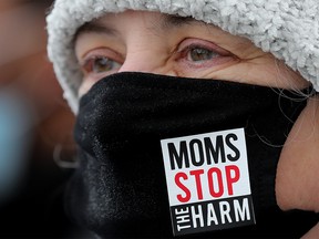 FILE PHOTO: Angela Welz, board member with Moms Stop The Harm, takes part in a protest organized by Albertans For Ethical Drug Policy at the Alberta Legislature in Edmonton, on Wednesday, February 23, 2022.