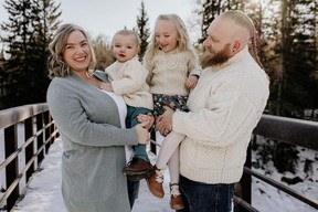Erin and Stefan Comyn are shown in a family photo with their children James (2) and Isobel (6).