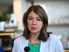 Alberta Premier Danielle Smith speaks at a southeast bakery called Sweet Rhapsody in Calgary on Wednesday, April 26.