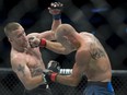 Donald "Cowboy" Cerrone, right, fights Justin Gaethje during their lightweight match at UFC Fight Night at Rogers Arena in Vancouver, Saturday, September, 14, 2019.