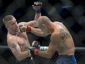 Donald "Cowboy" Cerrone, right, fights Justin Gaethje during their lightweight match at UFC Fight Night at Rogers Arena in Vancouver, Saturday, September, 14, 2019.