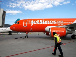 A Canada Jetlines Airbus A320 jet pulls into the Calgary airport gate Thursday, Sept. 22, 2022, on the airline's first flight in Calgary, Alta.