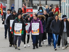 Government workers picket outside the federal government Harry Hays Building in downtown Calgary after 155,000 Public Service Alliance of Canada workers went on strike on Wednesday, April 19, 2023.