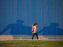 An elementary school student walks to the first day of classes at a school in southeast Calgary on Thursday, September 1, 2022.