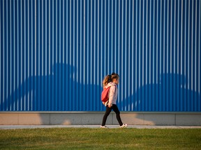 FILE PHOTO: An elementary school student walks to the first day of classes at Mahogany School in Calgary, Thursday, Sept. 1, 2022.