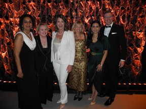 From left at the 2023 Calgary Influential Women in Business Awards April 13 are, with Premier Danielle Smith (third from left) award recipients Sippy Chhina, Andrea Robertson, Smith, Sue Riddell Rose, Manjit Minhas and Mark Brown. Missing from the photo is Kelly Schmitt.  Bill Brooks photo.