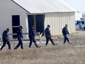 Police search for evidence at the property on Sunday.