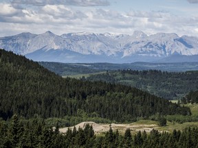 A section of the eastern slopes of the Canadian Rockies is seen west of Cochrane, Alta., Thursday, June 17, 2021. An Australian coal company is withdrawing its plan for a mine in the Crowsnest Pass region of the eastern slopes of Alberta's Rocky Mountains.