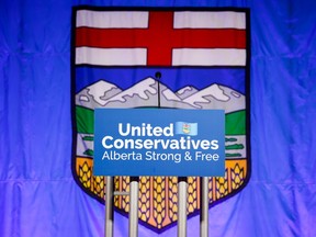 A United Conservative Party of Alberta's sign is shown in front of the Alberta flag prior to the party's leadership announcement in Calgary on Oct. 6, 2022.