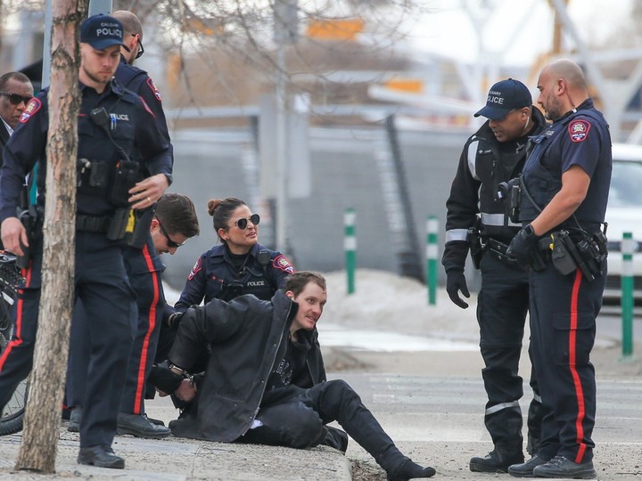  Police arrest a suspect after three people were stabbed in downtown Calgary on Monday, April 3.