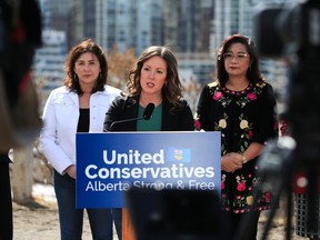 Calgary-Shaw MPP Rebecca Schulz is supported by other UCP MPs during a press conference on policing and crime in the province on Wednesday.