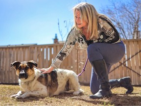 Foster parent Heidi Pietz spends time with rescue dog Polka in her northwest Calgary backyard on Saturday, April 15, 2023.
