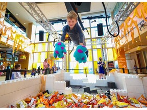 Jonas Berard, 6, had fun trying out the human claw machine to grab treats at Telus Spark on Oct. 30, 2022. 
Gavin Young/Postmedia.
