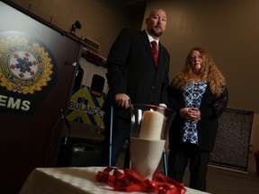 Susan White stands with MADD Calgary Interim Vice President Aaron Libby at the launch of MADD's Project Red Ribbon to promote sober driving during the holiday season on Wednesday, November 16, 2022.