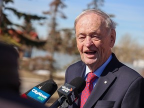 Former Canadian prime minister Jean Chretien speaks with media outside Calgary Skyview MP George Chahal’s constituency office on Thursday.