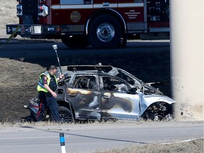 Calgary police investigate a single vehicle fatal collision that hit an overpass and burst into flames on Stoney Trail in Calgary on Thursday, April 6.