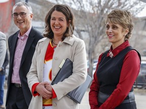 Calgary Sport and Entertainment Corp. CEO John Bean, left, Alberta Premier Danielle Smith and Calgary Mayor Jyoti Gondek attend an announcement on plans for an events centre to replace the aging Saddledome in Calgary on April 25, 2023.