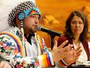 Enoch Cree Nation Chief Cody Thomas, left, participates in a news conference on Monday, April 24, 2023, where he signed a memorandum of understanding with Premier Danielle Smith for the development of a new 75-bed recovery facility on the First Nation.