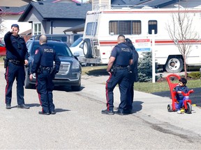 Calgary police investigate a shooting between two vehicles on Castleglen Crescent N.E. in Calgary on Saturday, April 22, 2023.