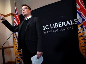 B.C. Liberal Leader Kevin Falcon reacts to the budget speech during a news conference at the legislature in Victoria, Tuesday, Feb. 28, 2023. The British Columbia Liberal Party formally becomes known as BC United on Wednesday, when Falcon will introduce the party's new name, logo and brand.