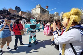 Participants prepare for the Calgary Expo Parade of Wonders at Olympic Plaza on Friday morning.