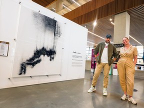 Tom McLeod and Shannon Lanigan were photographed with their new exhibit at the Calgary Central Library on Monday, May 1, 2023. 
Gavin Young/Postmedia
