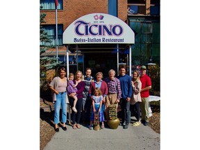 The Widmer family poses in front of Ticino on Banff Avenue