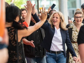 Alberta NDP Leader Rachel Notley greets her supporters after a rally in downtown Calgary on Saturday, May 27, 2023.