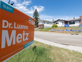 Neighbours in Silver Spring express their political views with yard signs on Tuesday, May 30, 2023.