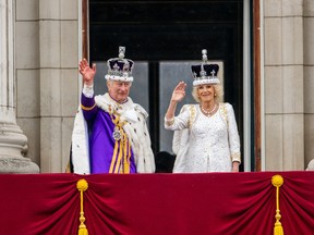 King Charles III and Queen Camilla wave goodbye on the Buckingham Palace balcony during the Coronation of King Charles III and Queen Camilla on May 06, 2023 in London, England. The Coronation of Charles III and his wife, Camilla, as King and Queen of the United Kingdom of Great Britain and Northern Ireland, and the other Commonwealth realms takes place at Westminster Abbey today. Charles acceded to the throne on 8 September 2022, upon the death of his mother, Elizabeth II.