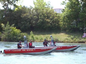 FILE PHOTO: Calgary Fire Department boats patrol the river near St Patrick’s Island in Calgary on Sunday, June 27, 2021.