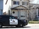 Calgary police hold the scene at a house on Martindale Drive N.E. in Calgary on Monday, May 1, 2023 in relation to a recent shooting.
