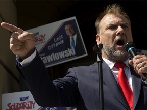 Artur Pawlowski on the steps of the Alberta legislature during the May 2023 provincial election