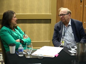 Calgary Sun columnist Rick Bell speaks with UCP Leader Danielle Smith in Calgary at Hotel Arts on Wednesday, May 24, 2023.