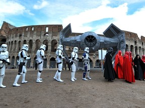 Members of a Star Wars fan club celebrate Star Wars Day in front of the Colosseum in central Rome on May 4, 2014. AFP Photo; Tiziana Fabitiziana; Getty Images.