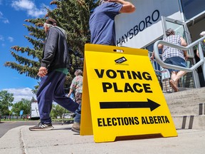 Calgarians vote at an advance poll for the provincial election at the Haysboro Community Centre in Calgary on Tuesday, May 23, 2023.