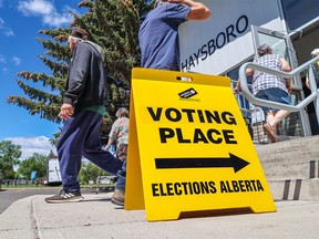 Calgarians vote at an advance poll for the 2023 Alberta provincial election