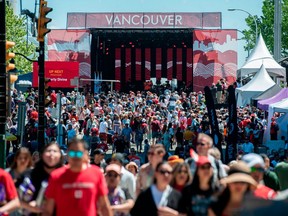 People take part in Canada Day festivities in downtown Vancouver on July 1, 2022.