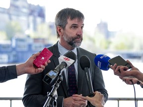 Environment Minister Steven Guilbeault speaks to reporters following a speech at the Montreal Climate Summit, May 10, 2023.