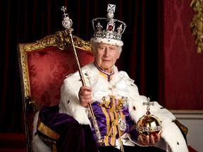 Britain's King Charles III poses in the Throne Room of Buckingham Palace, London, following his coronation on May 6.