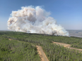 A wildfire burns a section of forest in the Grande Prairie district of Alberta on May 6.