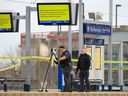 Calgary police investigate the scene of an early morning life-threatening stabbing at the Marlborough CTrain station on Wednesday, May 10, 2023.