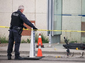 Calgary police investigate the scene of an early morning shooting near 36th Street and 17th Avenue S.E. on Wednesday.