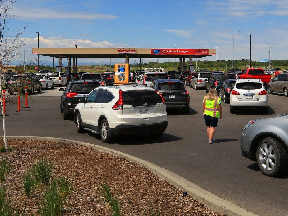 Cars line up for gas in Calgary at the Costco on Tsuut’ina Nation on June 23, 2021.